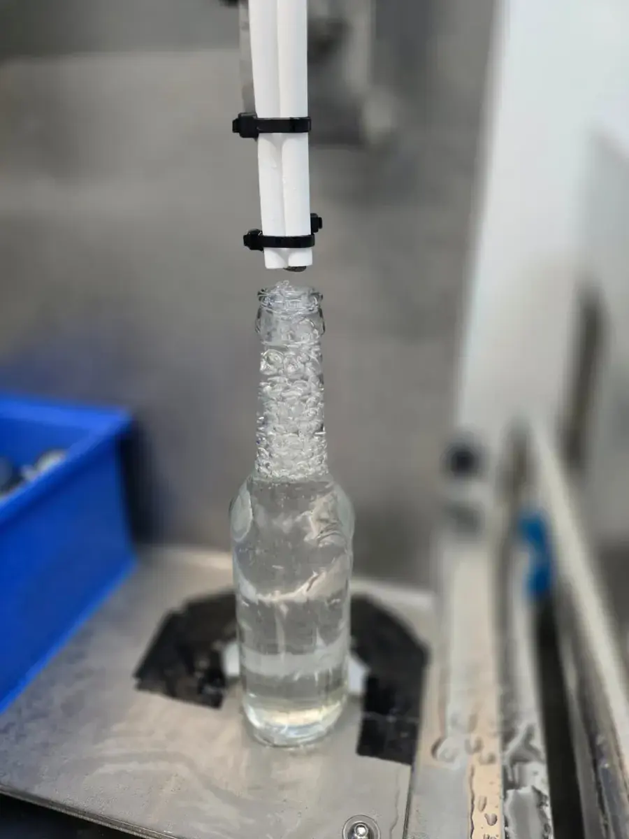 Close-up of an AWAKE bottle during filling